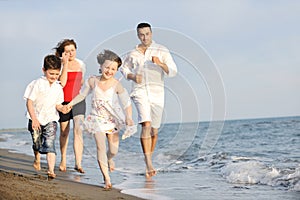 Happy young family have fun on beach