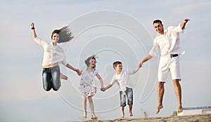 Happy young family have fun on beach