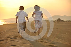 Happy young family have fun on beach