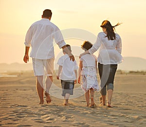 Happy young family have fun on beach