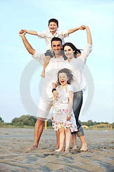 Happy young family have fun on beach