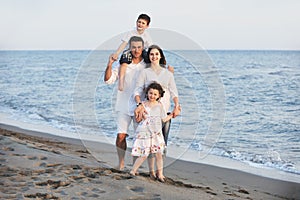 Happy young family have fun on beach