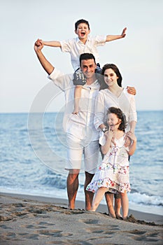 Happy young family have fun on beach