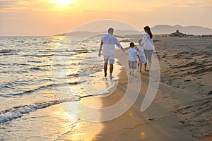 Happy young family have fun on beach