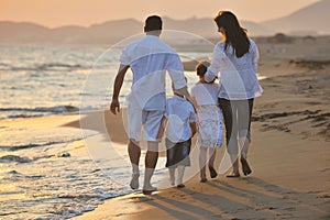 Happy young family have fun on beach