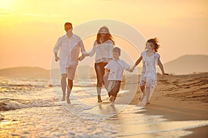 Happy young family have fun on beach