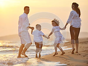 Happy young family have fun on beach