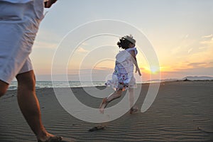 Happy young family have fun on beach