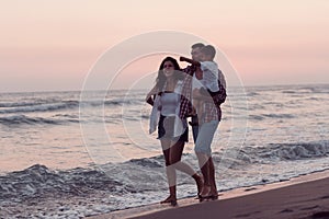 Happy young family have fun and live healthy lifestyle on beach. Selective focus