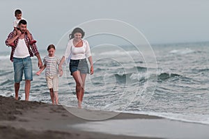 Happy young family have fun and live healthy lifestyle on beach. Selective focus