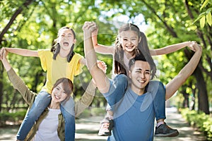 Happy young family having fun outdoors