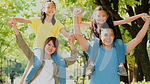 Happy young family having fun outdoors