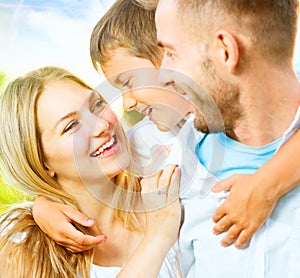 Happy young family having fun outdoors