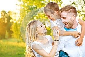 Happy young family having fun outdoors