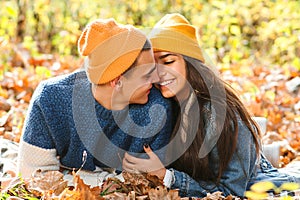 Happy young family having fun outdoors. Autumn fashion. Family, love, relationship and lifestyle. Stylish girl with boyfriend