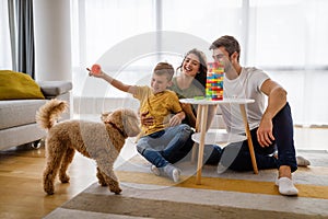 Happy young family having fun together at home. Happy childhood concept