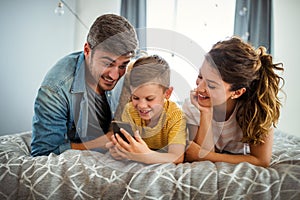 Happy young family having fun together at home. Happy childhood concept