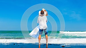 Happy young family on honeymoon beach holiday