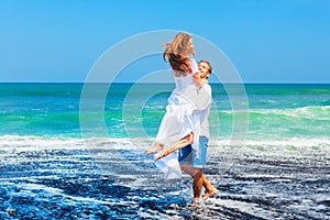 Happy young family on honeymoon beach holiday