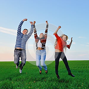 Happy young family jump for joy