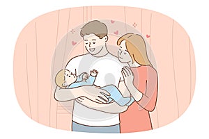 Happy loving young family holding newborn baby