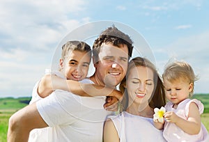 Happy young family outdoors