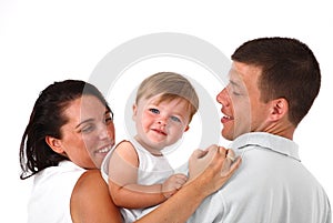Happy young family with pretty baby