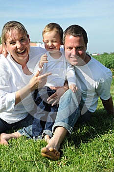 Happy young family with small child