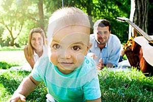 Happy young family spending time outdoor on a summer day