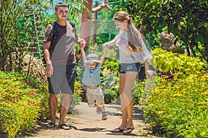 Happy young family spending time outdoor on a summer day