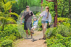 Happy young family spending time outdoor on a summer day