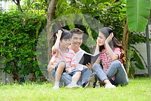 A happy young family spends time playing together