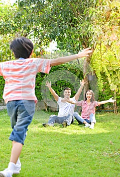 A happy young family spends time playing together