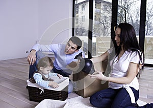 Happy young family in their new apartment