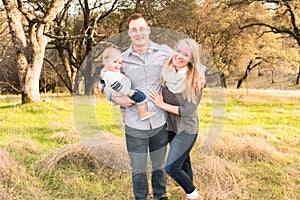 Happy Young Family Together Outdoors