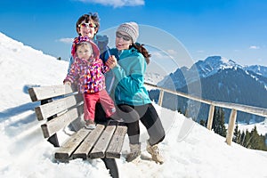 Happy young family in winter vacation