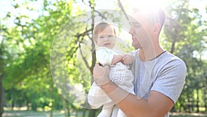 Happy young father spending time together with little daughter outdoors