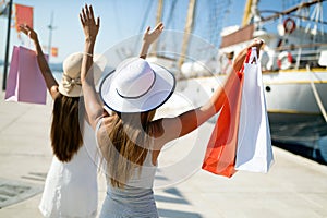 Happy young female on luxury vacation. Travel, shopping, fun, friends concept