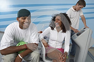 Happy Young Friends At Bowling Alley