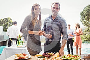 Happy young friends having drinks