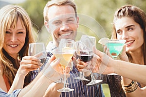 Happy young friends having drinks