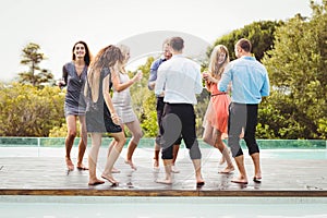 Happy young friends having drinks