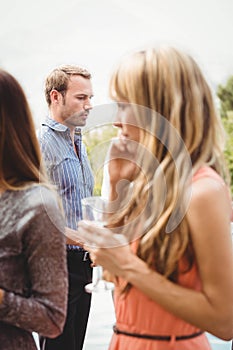 Happy young friends having drinks