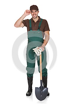 Happy young gardener in dungarees