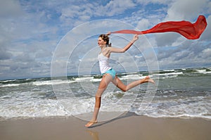 Happy young girl on the beach