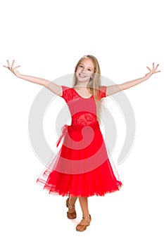 Happy young girl dances photo