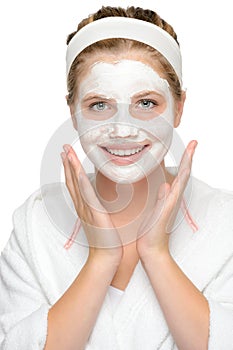 Happy young girl face mask smiling cosmetics