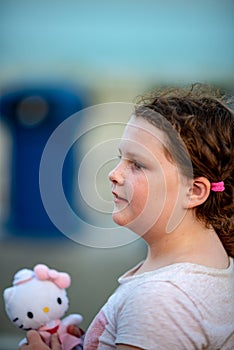 Happy young girl having fun on boardwalk amusement ride