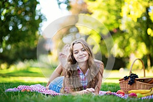 Happy young girl having a picnic