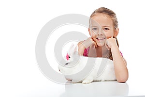 Happy young girl and her grumpy white bunny